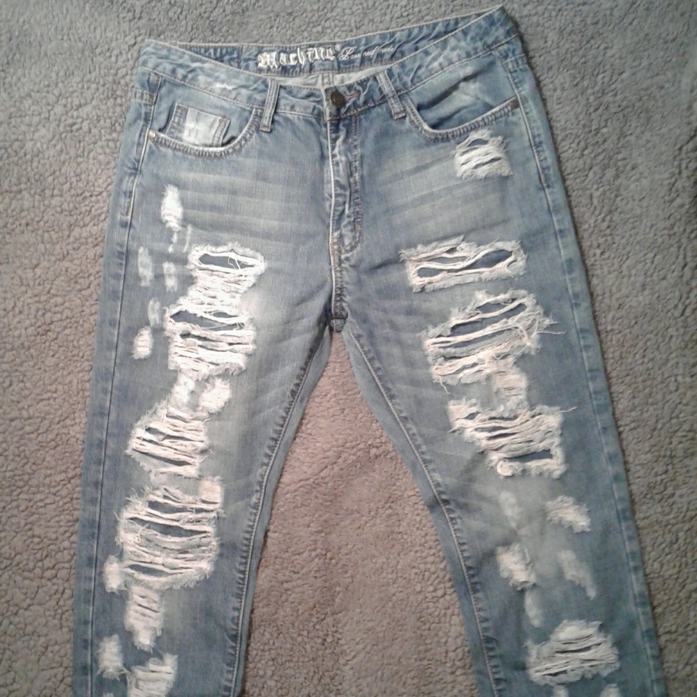 Ripped jeans with jean patches underneath.